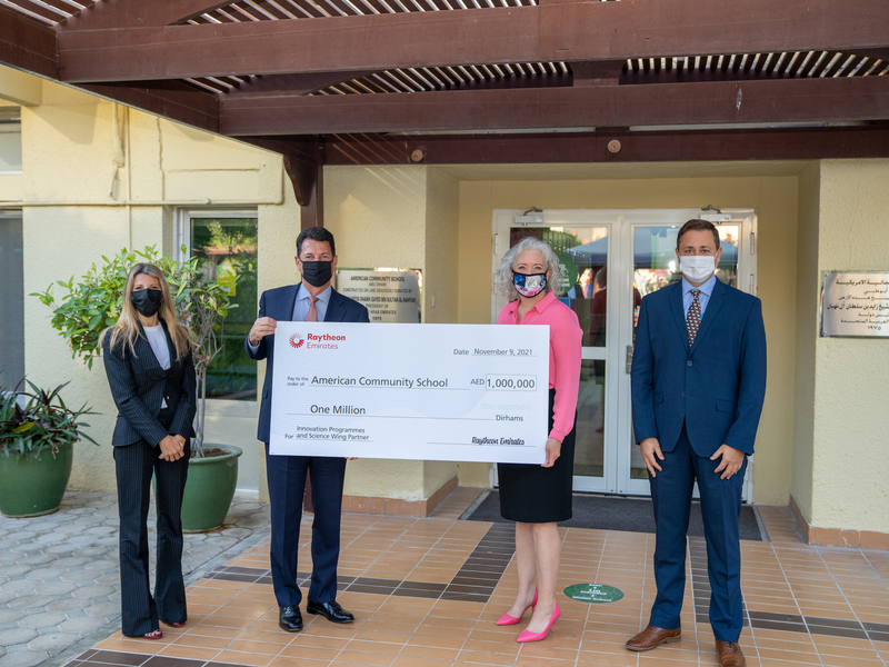 Raytheon Presents Check to ACS Raytheon Presents Check to ACS